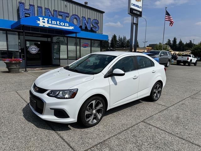 2018 Chevrolet Sonic Premier in Summit White — front three-quarter view