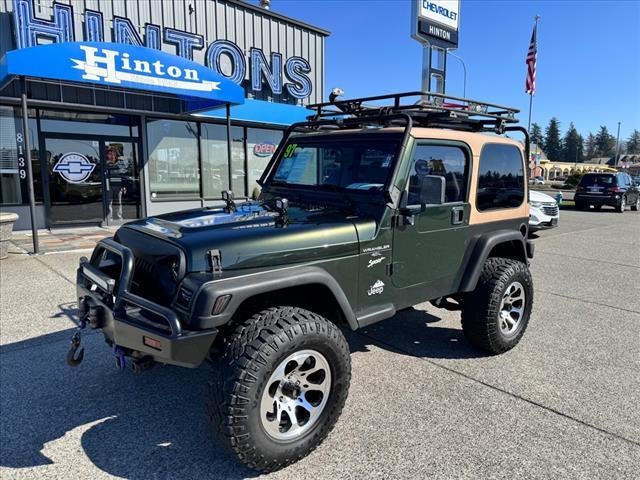 1997 Jeep Wrangler Sport in Green — front three-quarter view